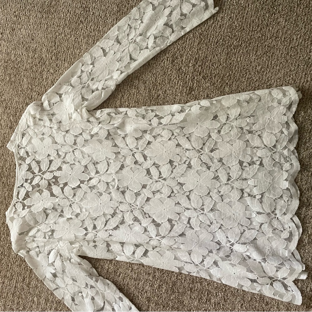White long sleeved lace swim suit cover up.